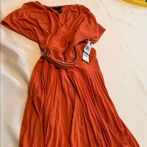 Orange belted pleated skirt dress